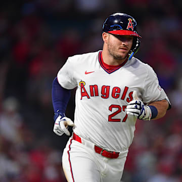 Los Angeles Angels designated hitter Mike Trout (27) runs after hitting a single against the Texas Rangers.