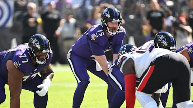 Baltimore Ravens quarterback Cooper Rush snaps the ball during the first quarter against the Houston Texans