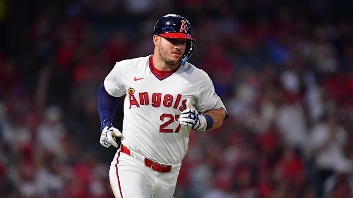 Los Angeles Angels designated hitter Mike Trout (27) runs after hitting a single against the Texas Rangers.
