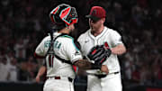 Jul 19, 2025; Phoenix, Arizona, USA; Arizona Diamondbacks catcher Jose Herrera (11) and pitcher Anthony DeSclafani (21) celebrates after defeating the St. Louis Cardinals at Chase Field. Mandatory Credit: Rick Scuteri-Imagn Images