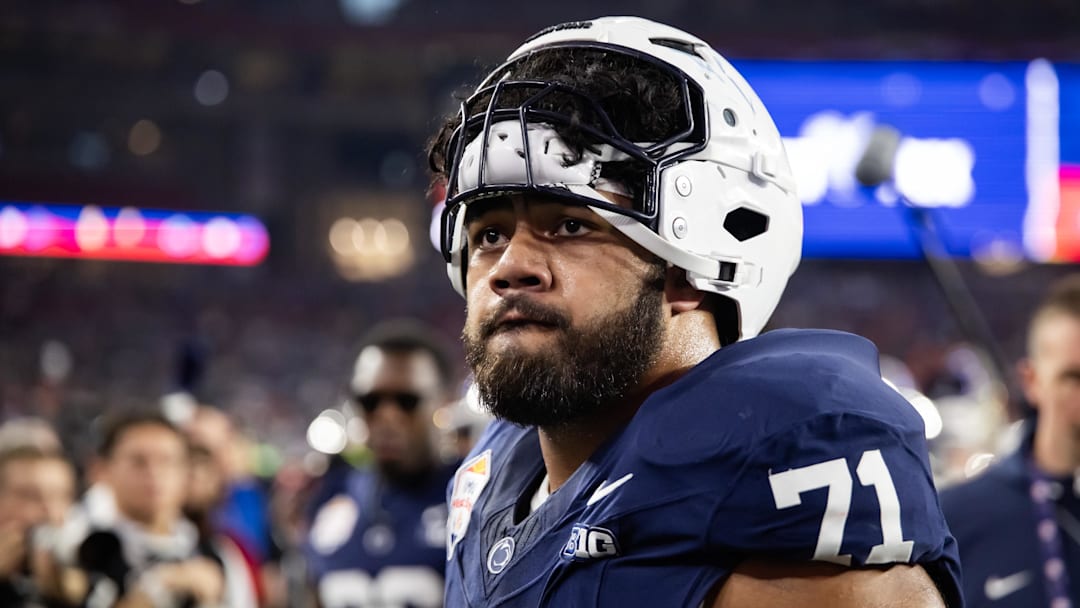 Dec 31, 2024; Glendale, AZ, USA; Penn State Nittany Lions offensive lineman Olaivavega Ioane (71) against the Boise State Broncos during the Fiesta Bowl at State Farm Stadium. Mandatory Credit: Mark J. Rebilas-Imagn Images
