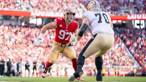 San Francisco 49ers defensive end Nick Bosa (97) rushes against New Orleans Saints tackle Trevor Penning (70) 