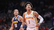 Dec 2, 2022; Atlanta, Georgia, USA; Atlanta Hawks forward Jalen Johnson (1) looks for a rebound in front of Denver Nuggets forward Aaron Gordon (50) in the first quarter at State Farm Arena.