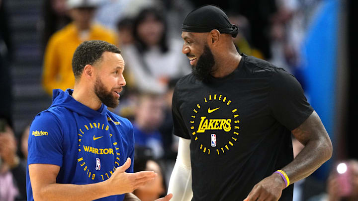 Golden State Warriors guard Stephen Curry (left) and Los Angeles Lakers forward LeBron James (right) share a brief moment before their game at Chase Center.