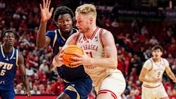 Nebraska Cornhuskers forward Rienk Mast drives against Florida International Panthers forward Eric Dibami during the first half at Pinnacle Bank Arena.