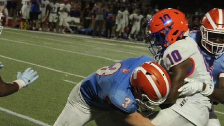 Boone linebacker Noah Maddox (3) makes a big tackle earlier this season. The senior will lead the No. 5 and unbeaten Braves (9-0) against No. 1 and undefeated Edgewater (9-0) this week. Boone linebacker Noah Maddox (3) makes a big tackle earlier this season. The senior will lead the No. 5 and unbeaten Braves (9-0) against No. 1 and undefeated Edgewater (9-0) this week.
