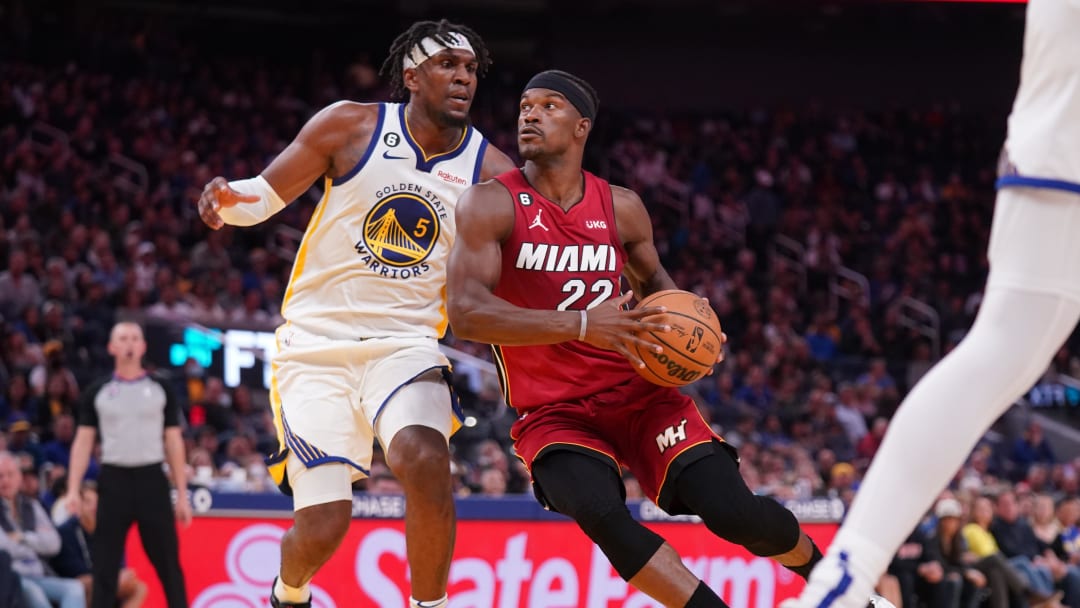 Oct 27, 2022; San Francisco, California, USA; Miami Heat forward Jimmy Butler (22) drives past Golden State Warriors forward Kevon Looney (5) in the fourth quarter at the Chase Center. Mandatory Credit: Cary Edmondson-USA TODAY Sports