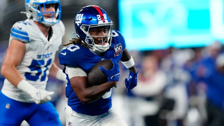 New York Giants running back Eric Gray (20) runs towards the end zone for the first touchdown of the game,, Thursday, August 8 2024, in East Rutherford.