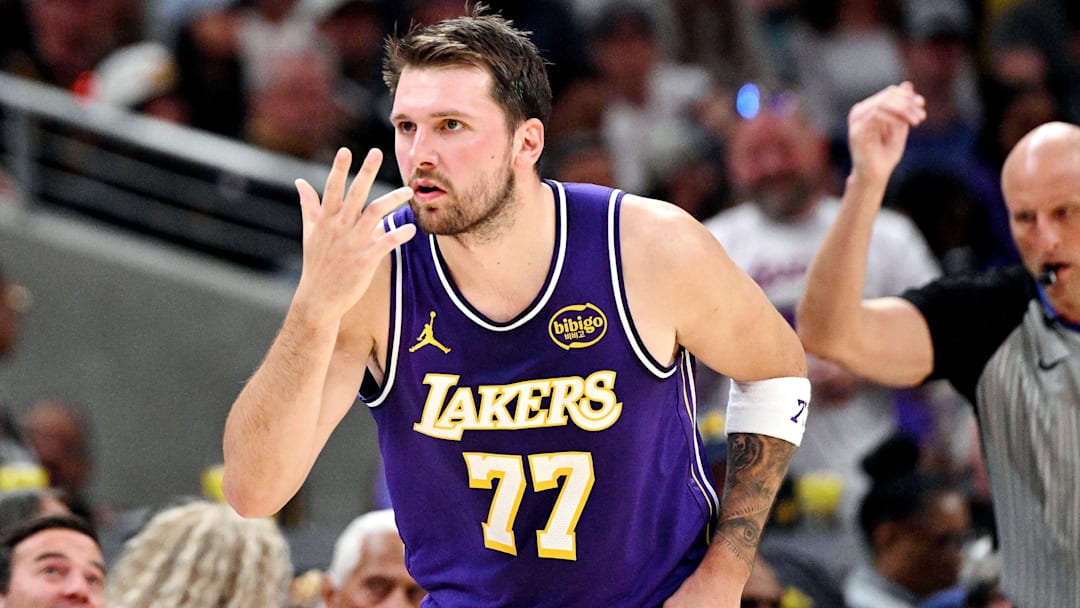 Los Angeles Lakers guard Luka Doncic (77) celebrates a three point shot during the second quarter against the Indiana Pacers at Gainbridge Fieldhouse. Mandatory Credit: Marc Lebryk-Imagn Images
