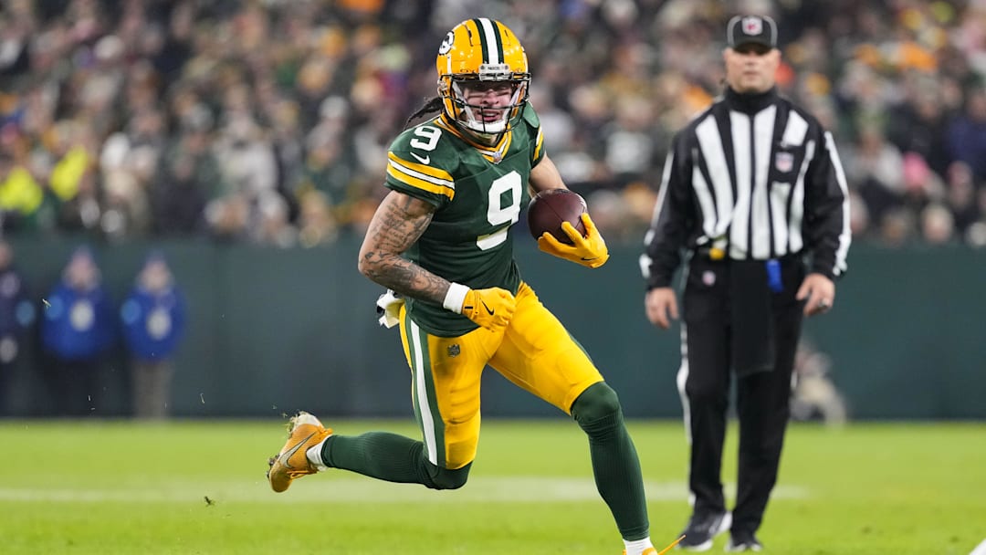 Dec 23, 2024; Green Bay, Wisconsin, USA;  Green Bay Packers wide receiver Christian Watson (9) rushes with the football during the second quarter against the New Orleans Saints at Lambeau Field. Mandatory Credit: Jeff Hanisch-Imagn Images
