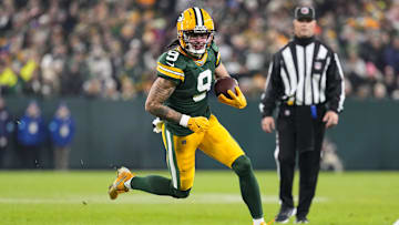 Dec 23, 2024; Green Bay, Wisconsin, USA;  Green Bay Packers wide receiver Christian Watson (9) rushes with the football during the second quarter against the New Orleans Saints at Lambeau Field. Mandatory Credit: Jeff Hanisch-Imagn Images
