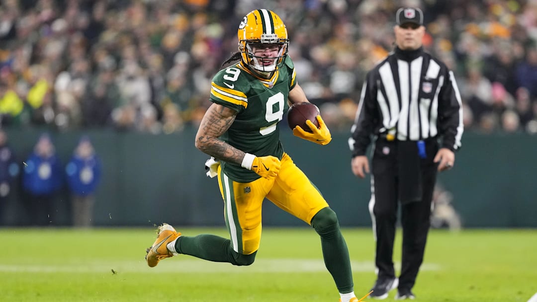 Dec 23, 2024; Green Bay, Wisconsin, USA;  Green Bay Packers wide receiver Christian Watson (9) rushes with the football during the second quarter against the New Orleans Saints at Lambeau Field.