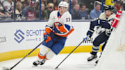 Oct 30, 2024; Columbus, Ohio, USA; New York Islanders center Mathew Barzal (13) skates with the puck against Columbus Blue Jackets defenseman Jordan Harris (22) in the first period at Nationwide Arena. Mandatory Credit: Aaron Doster-Imagn Images