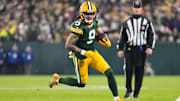 Dec 23, 2024; Green Bay, Wisconsin, USA;  Green Bay Packers wide receiver Christian Watson (9) rushes with the football during the second quarter against the New Orleans Saints at Lambeau Field. Mandatory Credit: Jeff Hanisch-Imagn Images