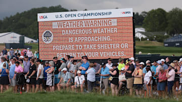 Jun 15, 2025; Oakmont, Pennsylvania, USA; A weather warning is displayed during the final round of the U.S. Open golf tournament. Mandatory Credit: Bill Streicher-Imagn Images
