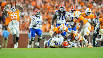 Tennessee defensive lineman James Pearce Jr. (27) and Tennessee defensive back Boo Carter (23) tackle Florida quarterback DJ Lagway (2)during a NCAA football game between Tennessee and Florida in Neyland Stadium, in Knoxville, Tenn., Oct. 12, 2024.