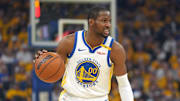 Apr 26, 2025; San Francisco, California, USA; Golden State Warriors forward Jonathan Kuminga (00) dribbles against the Houston Rockets during the first quarter of game three of first round for the 2024 NBA Playoffs at Chase Center. Mandatory Credit: Darren Yamashita-Imagn Images