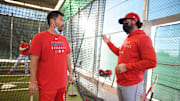 Angels catcher Kurt Suzuki (left) during spring training workouts at Tempe Diablo Stadium on Feb. 17, 2021.