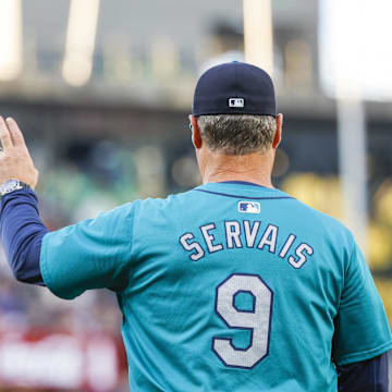 Seattle Mariners manager Scott Servais (9) signals for a pitching change against the Philadelphia Phillies during the fifth inning at T-Mobile Park in 2024.