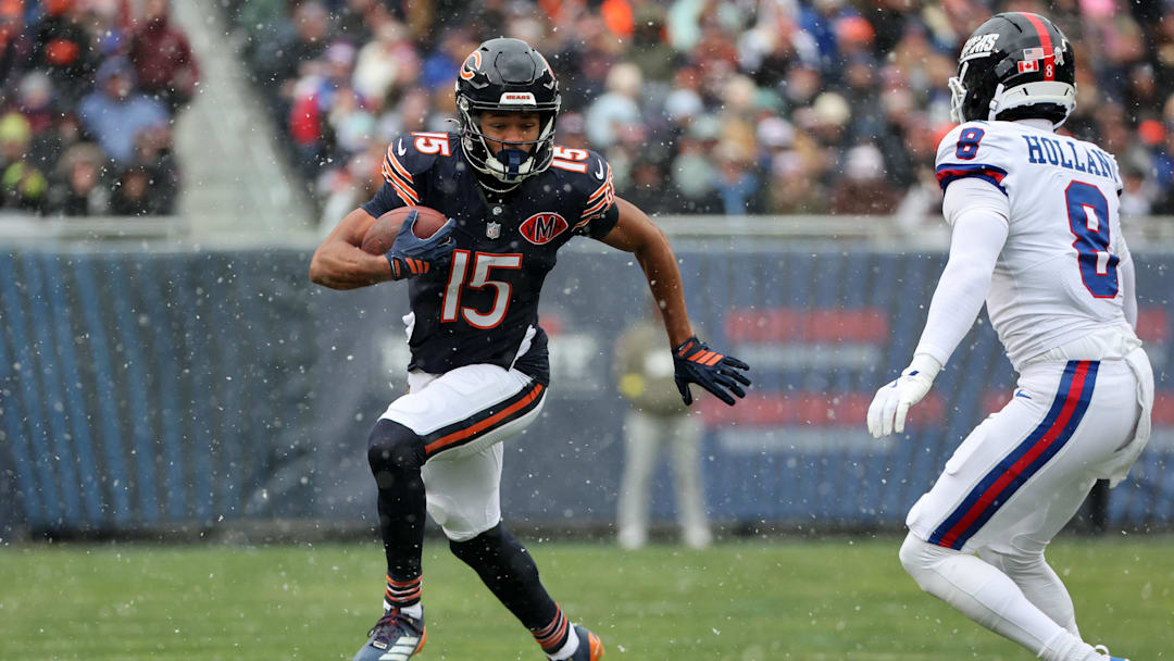 Nov 9, 2025; Chicago, Illinois, USA; Chicago Bears wide receiver Rome Odunze (15) makes a catch against New York Giants safety Jevon Holland (8) during the first half at Soldier Field. 