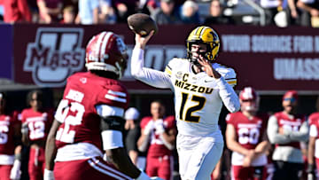 Oct 12, 2024; Amherst, Massachusetts, USA; Missouri Tigers quarterback Brady Cook (12)  throws a pass during the second half against the Massachusetts Minutemen at Warren McGuirk Alumni Stadium. Mandatory Credit: Eric Canha-Imagn Images