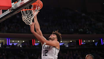 Nov 18, 2025; New York, New York, USA; Duke Blue Devils forward Cameron Boozer (12) goes to the basket against the Kansas Jayhawks during the second half at Madison Square Garden. 