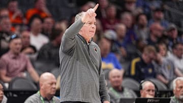 Mar 11, 2025; Charlotte, NC, USA; Virginia Tech Hokies head coach Mike Young signals to his team during the first half against the California Golden Bears at Spectrum Center. Mandatory Credit: Jim Dedmon-Imagn Images