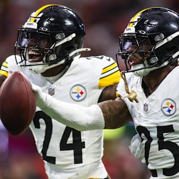 Sep 8, 2024; Atlanta, Georgia, USA; Pittsburgh Steelers safety DeShon Elliott (25) celebrates with cornerback Joey Porter Jr. (24) after an interception against the Atlanta Falcons in the first quarter at Mercedes-Benz Stadium. Mandatory Credit: Brett Davis-Imagn Images