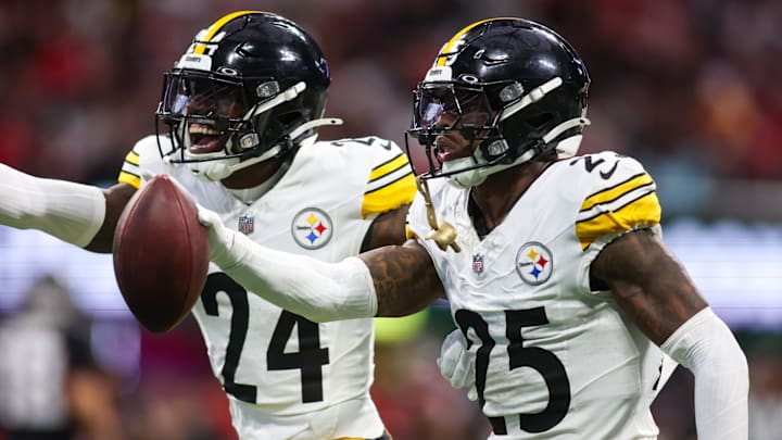 Sep 8, 2024; Atlanta, Georgia, USA; Pittsburgh Steelers safety DeShon Elliott (25) celebrates with cornerback Joey Porter Jr. (24) after an interception against the Atlanta Falcons in the first quarter at Mercedes-Benz Stadium. Mandatory Credit: Brett Davis-Imagn Images