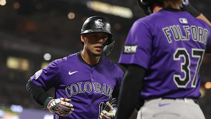 Sep 26, 2025; San Francisco, California, USA; Colorado Rockies shortstop Ezequiel Tovar (14) celebrates with catcher Braxton Fulford (37) after batting him in on a three-run home run against the San Francisco Giants during the fifth inning at Oracle Park. Mandatory Credit: Kelley L Cox-Imagn Images