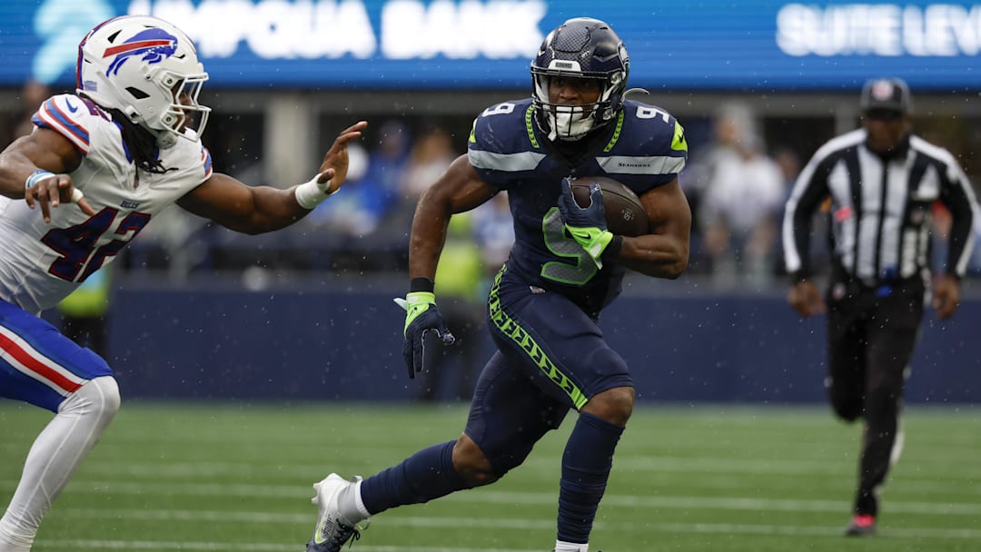 Seattle Seahawks running back Kenneth Walker III rushes against Buffalo Bills linebacker Dorian Williams.