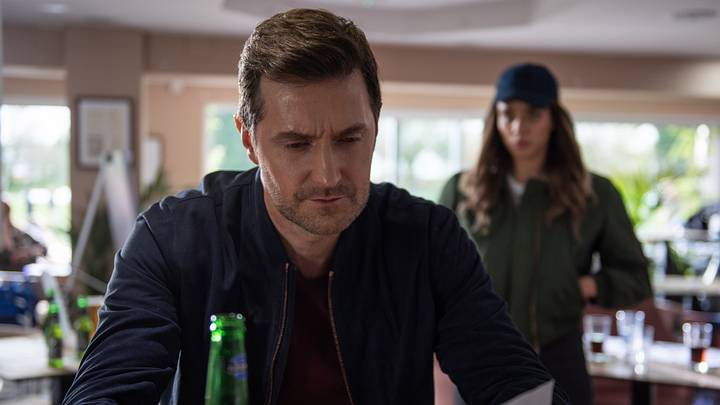 Richard Armitage as Adam Price and Hannah John-Kamen as The Stranger in The Stranger