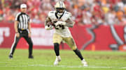 Dec 7, 2025; Tampa, Florida, USA; New Orleans Saints running back Devin Neal (24) runs for a gain during the fourth quarter against the Tampa Bay Buccaneers at Raymond James Stadium. Mandatory Credit: Nathan Ray Seebeck-Imagn Images