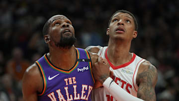 Mar 30, 2025; Phoenix, Arizona, USA; Phoenix Suns forward Kevin Durant (35) and Houston Rockets forward Jabari Smith Jr. (10) fight for position in the first half at Footprint Center. Mandatory Credit: Rick Scuteri-Imagn Images