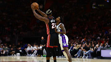 Nov 4, 2024; Miami, Florida, USA; Miami Heat forward Jimmy Butler (22) protects the basketball from Sacramento Kings guard Malik Monk (0) during the second quarter at Kaseya Center. Mandatory Credit: Sam Navarro-Imagn Images