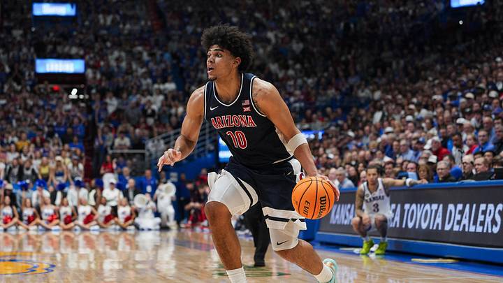 Feb 7, 2026; Lawrence, Kansas, USA; Arizona Wildcats forward Koa Peat (10) drives during the first half against the Kansas Jayhawks at Allen Fieldhouse. Mandatory Credit: Jay Biggerstaff-Imagn Images