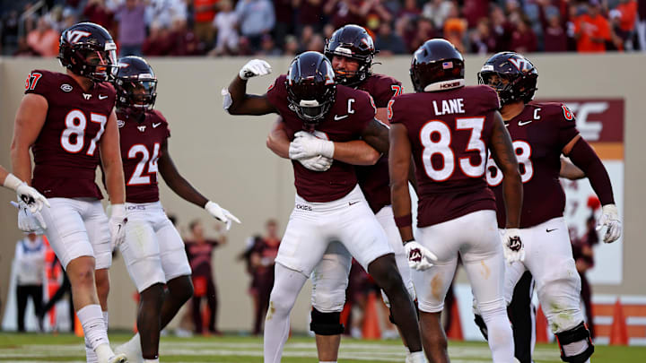 Sep 7, 2024; Blacksburg, Virginia, USA; Virginia Tech Hokies wide receiver Da'Quan Felton (9) celebrates with his teammates after making a touchdown catch during the fourth quarter against the Marshall Thundering Herd at Lane Stadium. Mandatory Credit: Peter Casey-Imagn Images