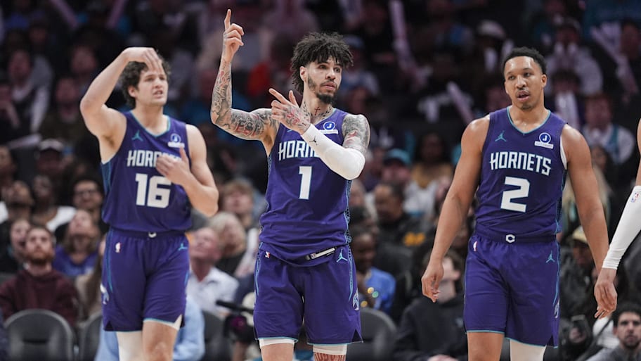 Charlotte Hornets guard LaMelo Ball and center PJ Hall call to look at the replay after a foul call.