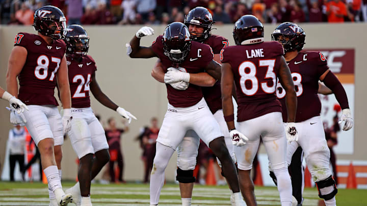 Sep 7, 2024; Blacksburg, Virginia, USA; Virginia Tech Hokies wide receiver Da'Quan Felton (9) celebrates with his teammates after making a touchdown catch during the fourth quarter against the Marshall Thundering Herd at Lane Stadium. Mandatory Credit: Peter Casey-Imagn Images