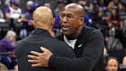 Nov 24, 2024; Sacramento, California, USA; Sacramento Kings head coach Mike Brown (right) and Brooklyn Nets head coach Jordi Fernandez (left) greet each other after the game at Golden 1 Center. Mandatory Credit: Darren Yamashita-Imagn Images