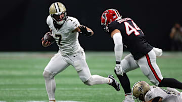 Taysom Hill (7) of the New Orleans Saints runs the ball against the Atlanta Falcons.