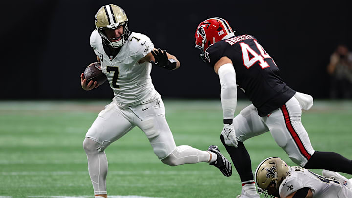 Taysom Hill (7) of the New Orleans Saints runs the ball against the Atlanta Falcons.