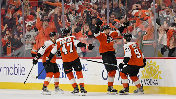 Apr 22, 2026; Philadelphia, Pennsylvania, USA; Philadelphia Flyers defenseman Rasmus Ristolainen (55) celebrates his goal with right wing Porter Martone (94) against the Pittsburgh Penguins during the second period in game three of the first round of the 2026 Stanley Cup Playoffs at Xfinity Mobile Arena. 