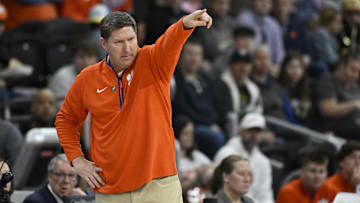 Mar 20, 2025; Providence, RI, USA; Clemson Tigers head coach Brad Brownell signals to his players during the first half against the McNeese State Cowboys at Amica Mutual Pavilion. Mandatory Credit: Eric Canha-Imagn Images
