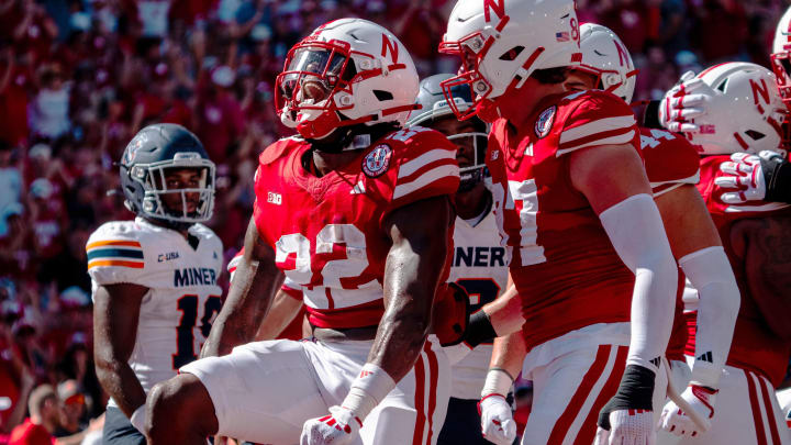 Aug 31, 2024; Lincoln, Nebraska, USA; Nebraska Cornhuskers running back Gabe Ervin Jr. (22) celebrates after scoring a touchdown against the UTEP Miners during the second quarter at Memorial Stadium.