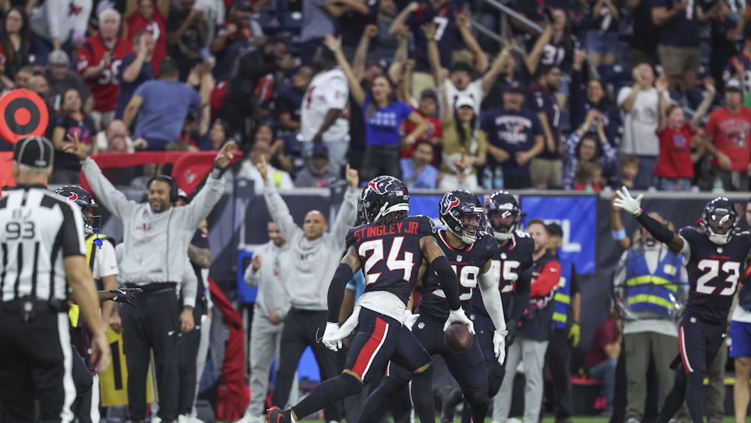 Dec 15, 2024; Houston, Texas, USA; Houston Texans cornerback Derek Stingley Jr. (24) runs with the ball after an interception during the fourth quarter against the Miami Dolphins at NRG Stadium. Mandatory Credit: Troy Taormina-Imagn Images