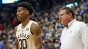 Feb 14, 2022; Lawrence, Kansas, USA; Kansas Jayhawks head coach Bill Self talks with guard Ochai Agbaji (30) against the Oklahoma State Cowboys during the game at Allen Fieldhouse. Mandatory Credit: Denny Medley-Imagn Images