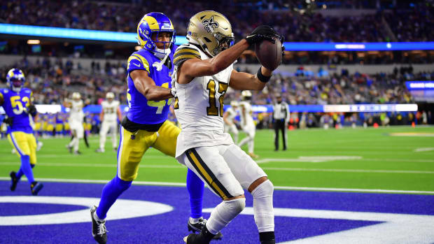 New Orleans Saints wide receiver Chris Olave (12) catches a pass for two point conversion ahead of Los Angeles Rams cornerbac