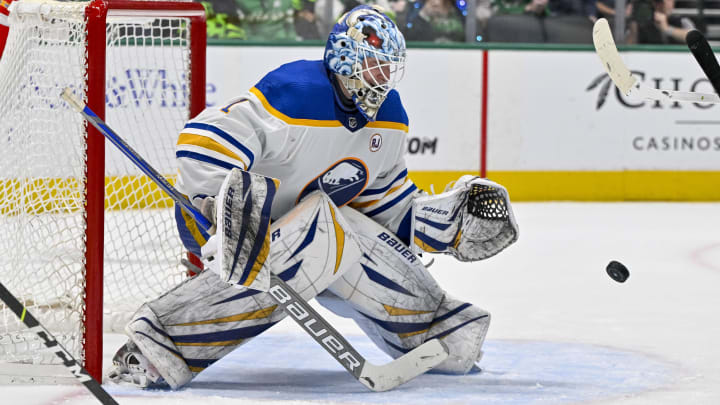 Apr 9, 2024; Dallas, Texas, USA; Buffalo Sabres goaltender Ukko-Pekka Luukkonen (1) makes a glove save against the Dallas Stars during the second period at the American Airlines Center. Mandatory Credit: Jerome Miron-USA TODAY Sports