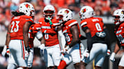 Louisville Cardinals defensive lineman Clev Lubin (50) and the defense celebrate a stop against visiting Eastern Kentucky University at the Cardinals' football season opener Saturday, August 30, 2025 at L&N Federal Credit Union Stadium in Louisville, Kentucky.